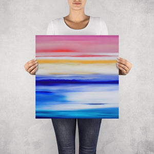 Santorini – limited edition abstract art print by INKIS, shown unframed and held for scale in 50 × 50 cm size, featuring vibrant pinks, blues, and yellow colour gradients, available at Tonomi