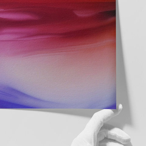 Close-up of a hand holding 'Sakura' abstract art print with red, blue hues, and purple abstract design